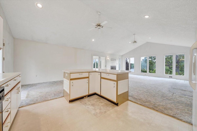 205 Park Shores Cir, Moneta, VA 24121 - kitchen with a ceiling fan, light colored carpet, open floor plan, vaulted ceiling, and light countertops