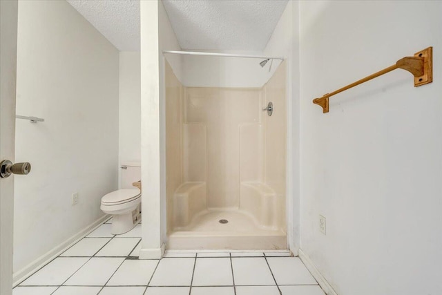 205 Park Shores Cir, Moneta, VA 24121 - bathroom featuring a shower stall, a textured ceiling, toilet, tile patterned floors, and baseboards