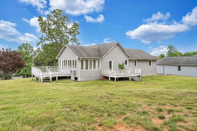 205 Park Shores Cir, Moneta, VA 24121 - back of property featuring a deck, a yard, roof with shingles, and a sunroom