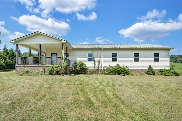 8163 Floyd Hwy N, Copper Hill, VA 24079 - rear view of house with a yard, metal roof, and a porch