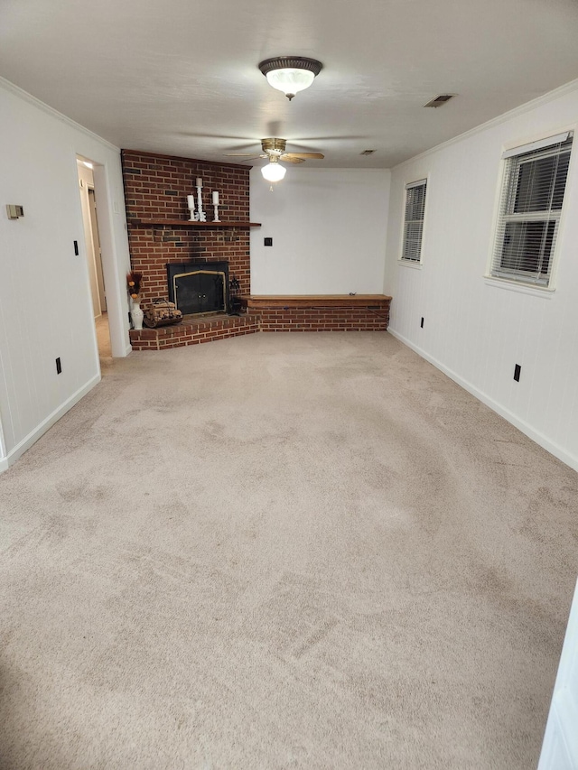 215 Overlook Rd, Vinton, VA 24179 - unfurnished living room with crown molding, a brick fireplace, baseboards, carpet flooring, and a ceiling fan