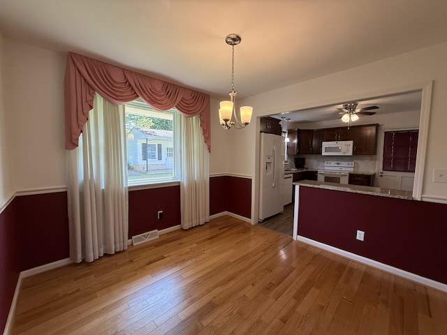 5265 Wipledale Ave, Roanoke, VA 24019 - kitchen with white appliances, light wood finished floors, dark brown cabinets, baseboards, and ceiling fan