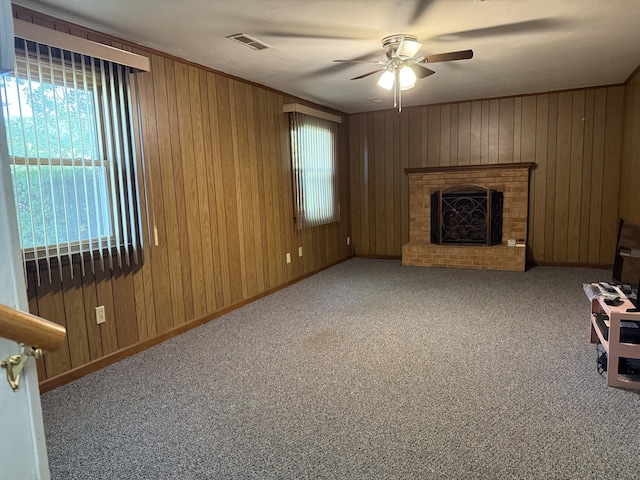 5265 Wipledale Ave, Roanoke, VA 24019 - unfurnished living room with a ceiling fan, plenty of natural light, wooden walls, and carpet flooring