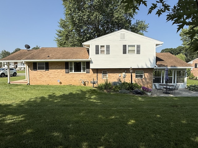 5265 Wipledale Ave, Roanoke, VA 24019 - back of property with a lawn, a patio area, and brick siding