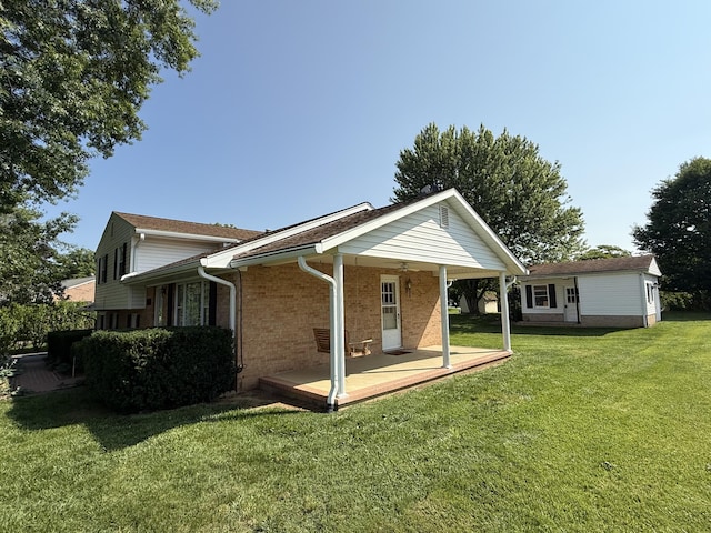 5265 Wipledale Ave, Roanoke, VA 24019 - back of house with brick siding and a yard