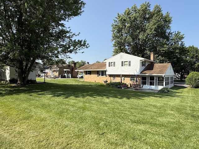 5265 Wipledale Ave, Roanoke, VA 24019 - view of grassy yard featuring a sunroom
