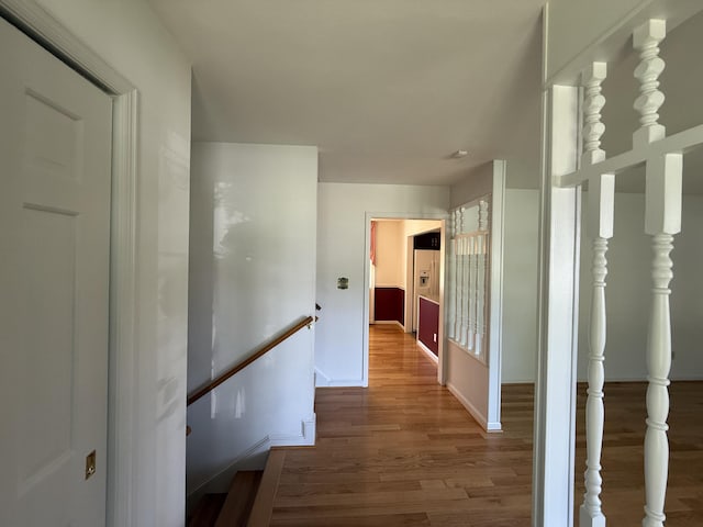 5265 Wipledale Ave, Roanoke, VA 24019 - hall with wood finished floors, an upstairs landing, and baseboards