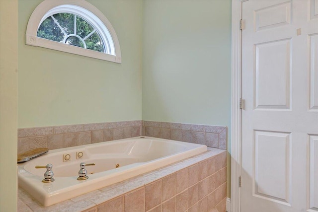 full bathroom featuring a whirlpool tub
