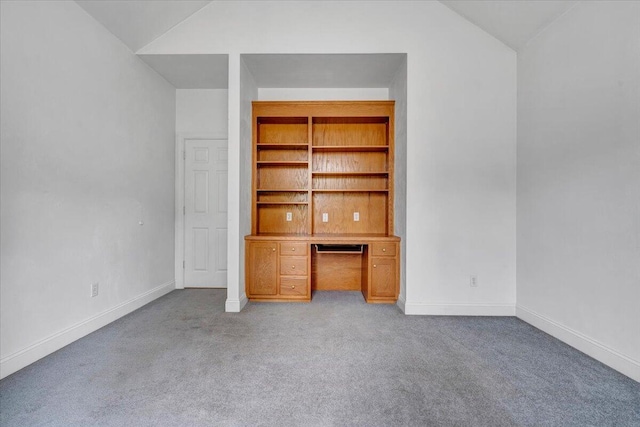 unfurnished bedroom with carpet floors, vaulted ceiling, and baseboards