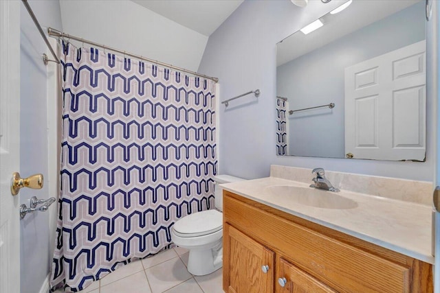 bathroom featuring tile patterned flooring, toilet, vanity, and curtained shower