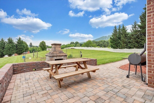 view of patio featuring an outdoor fireplace