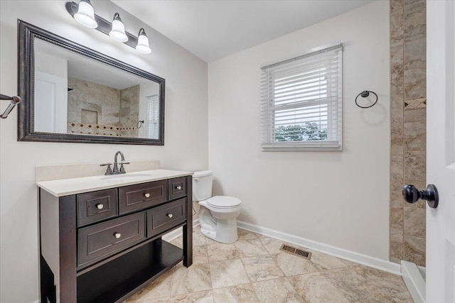 8209 Webster Dr, Roanoke, VA 24019 - full bathroom featuring vanity, tiled shower, toilet, and baseboards