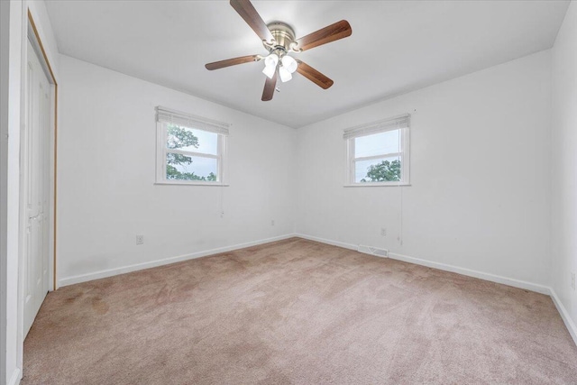 8209 Webster Dr, Roanoke, VA 24019 - unfurnished bedroom with multiple windows, carpet floors, and baseboards