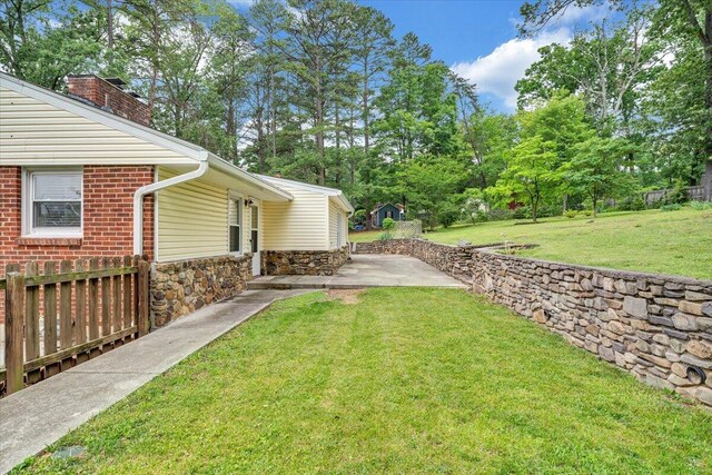 8209 Webster Dr, Roanoke, VA 24019 - view of green lawn featuring a patio