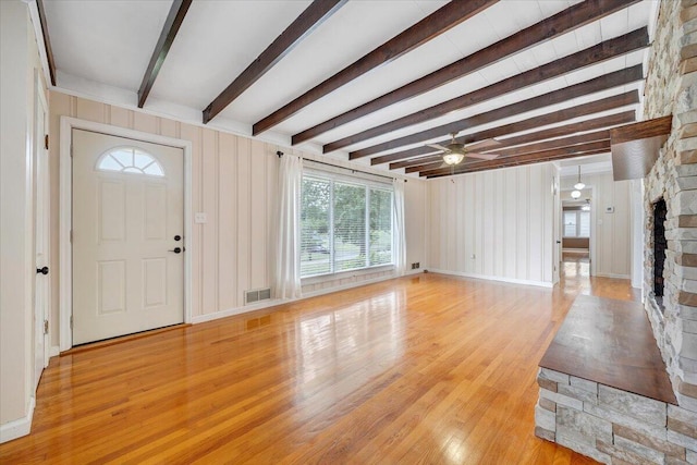 8209 Webster Dr, Roanoke, VA 24019 - foyer with light wood finished floors, beam ceiling, ceiling fan, a fireplace, and baseboards