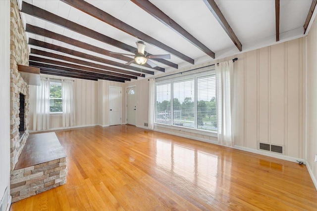 8209 Webster Dr, Roanoke, VA 24019 - unfurnished living room featuring beam ceiling, light wood-style flooring, a ceiling fan, and a fireplace
