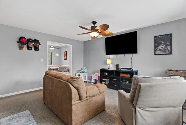 8574 Brubaker Dr, Roanoke, VA 24019 - carpeted living room featuring ceiling fan and baseboards