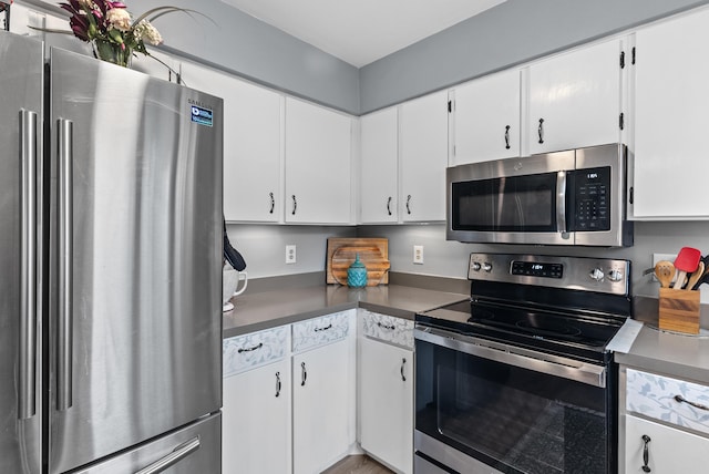 8574 Brubaker Dr, Roanoke, VA 24019 - kitchen with stainless steel appliances, white cabinetry, and dark countertops