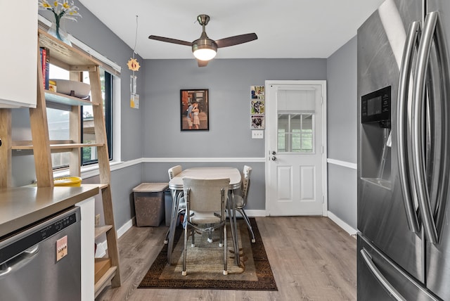 8574 Brubaker Dr, Roanoke, VA 24019 - dining room featuring wood finished floors, ceiling fan, and baseboards
