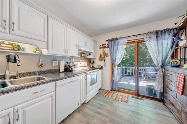 919 Halifax Cir, Vinton, VA 24179 - kitchen featuring white appliances, white cabinetry, under cabinet range hood, a sink, and dark countertops