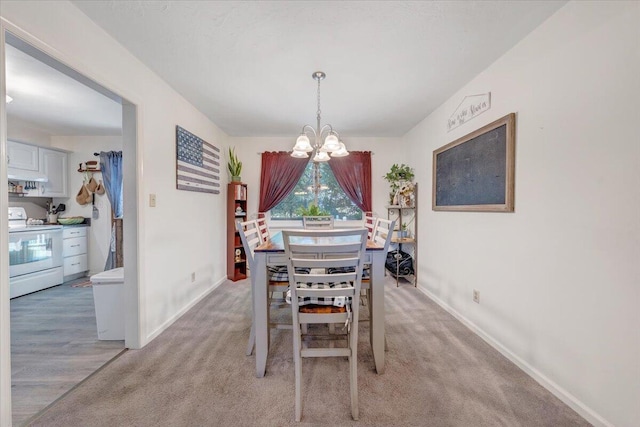 919 Halifax Cir, Vinton, VA 24179 - dining room featuring a chandelier, baseboards, and light colored carpet