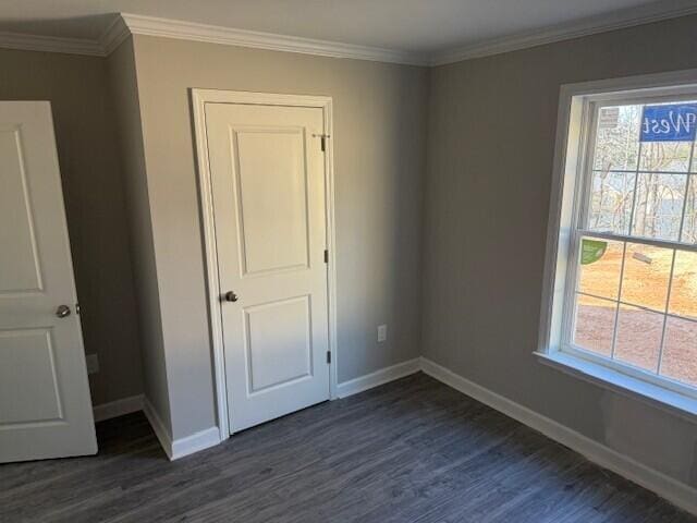 1800 Hardy Rd, Vinton, VA 24179 - unfurnished bedroom featuring baseboards, dark wood-type flooring, and ornamental molding