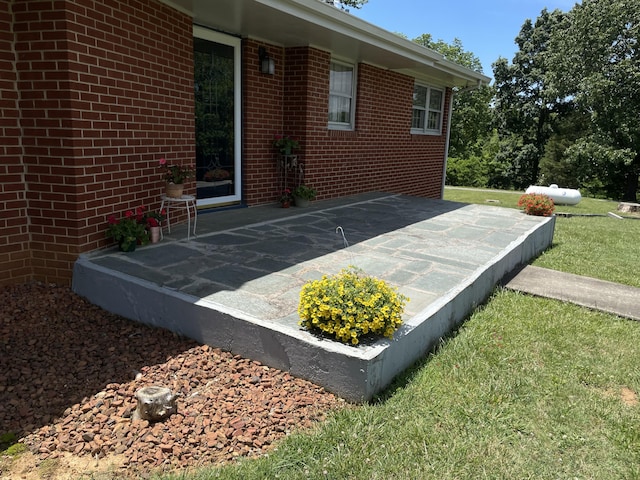 exterior view of brick siding and heating fuel tank