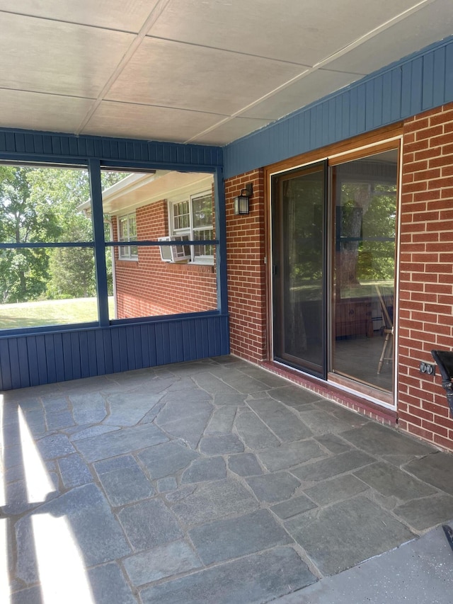 unfurnished sunroom featuring cooling unit