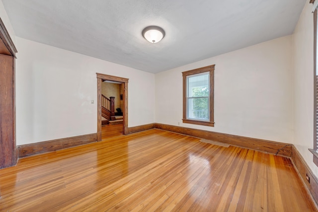 3759 Mill Iron Rd, Goodview, VA 24095 - spare room with light wood finished floors, baseboards, and stairs