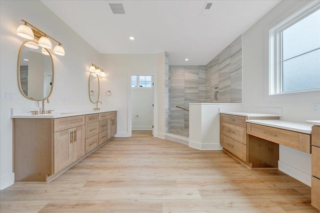 LOT243 Flagstick Ct, Penhook, VA 24137 - bathroom with double vanity, tiled shower, wood finished floors, baseboards, and recessed lighting