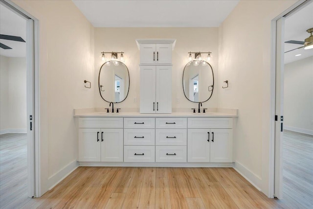 LOT243 Flagstick Ct, Penhook, VA 24137 - full bath with wood finished floors, double vanity, baseboards, and ceiling fan