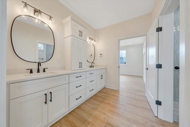 LOT243 Flagstick Ct, Penhook, VA 24137 - full bath with double vanity, wood finished floors, and baseboards