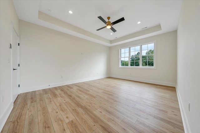 LOT243 Flagstick Ct, Penhook, VA 24137 - empty room featuring a tray ceiling, light wood finished floors, a ceiling fan, and recessed lighting