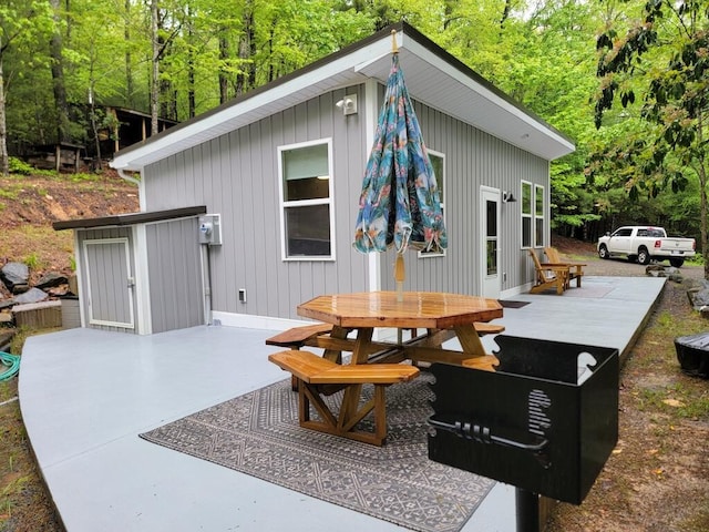 3119 Buffalo Mountain Rd SW, Willis, VA 24380 - view of patio with outdoor dining area and a wooded view