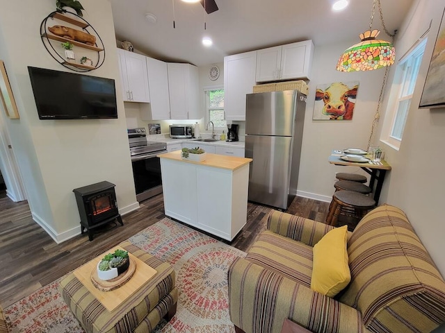 3119 Buffalo Mountain Rd SW, Willis, VA 24380 - kitchen featuring stainless steel appliances, white cabinetry, dark wood finished floors, a kitchen island, and recessed lighting