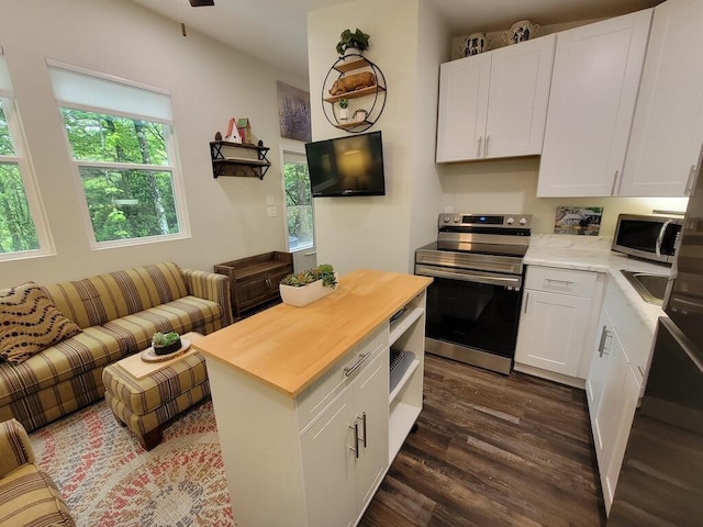 3119 Buffalo Mountain Rd SW, Willis, VA 24380 - kitchen featuring stainless steel appliances, dark wood-style flooring, white cabinets, open floor plan, and butcher block counters