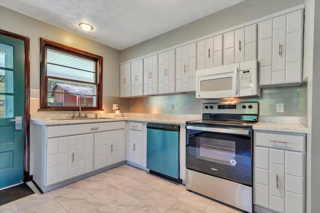 1104 Dolly Ann Dr, Covington, VA 24426 - kitchen featuring white microwave, dishwasher, stainless steel range with electric cooktop, a sink, and backsplash