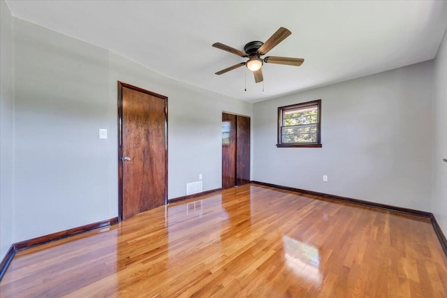 1104 Dolly Ann Dr, Covington, VA 24426 - unfurnished room with wood finished floors, baseboards, and a ceiling fan