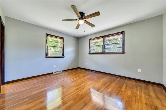 1104 Dolly Ann Dr, Covington, VA 24426 - spare room featuring plenty of natural light, light wood-style floors, a ceiling fan, and baseboards