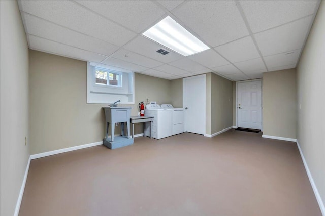 1104 Dolly Ann Dr, Covington, VA 24426 - below grade area with washer and clothes dryer, baseboards, a drop ceiling, and carpet flooring