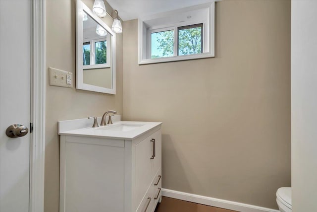 1104 Dolly Ann Dr, Covington, VA 24426 - bathroom featuring vanity, toilet, and baseboards