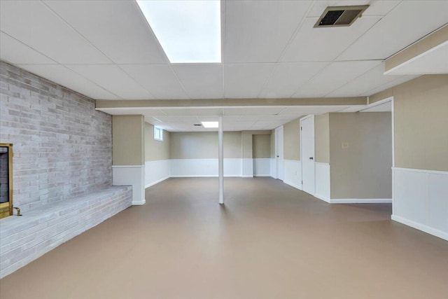 1104 Dolly Ann Dr, Covington, VA 24426 - below grade area with a drop ceiling, a brick fireplace, and brick wall