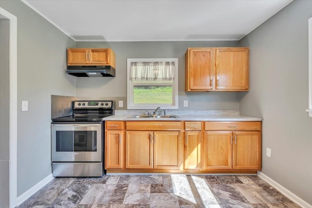 1104 Dolly Ann Dr, Covington, VA 24426 - kitchen with electric stove, a sink, under cabinet range hood, light countertops, and baseboards