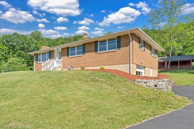 1104 Dolly Ann Dr, Covington, VA 24426 - ranch-style house featuring brick siding, a chimney, an attached garage, and a front yard