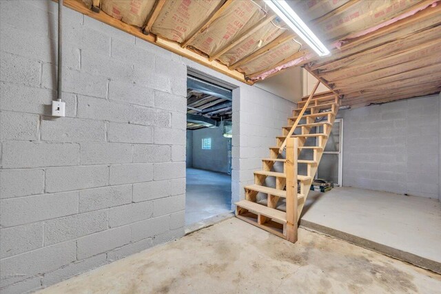 1104 Dolly Ann Dr, Covington, VA 24426 - unfinished below grade area featuring stairway and concrete block wall