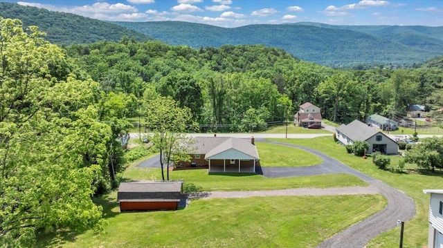 1104 Dolly Ann Dr, Covington, VA 24426 - drone / aerial view of a heavily wooded area and a mountainous background