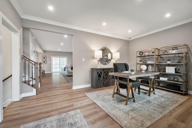 office area featuring wood finished floors, baseboards, ornamental molding, and recessed lighting