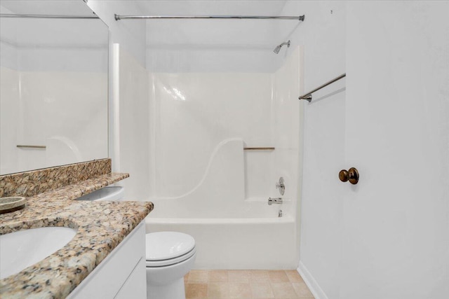 bathroom with toilet, vanity, and tub / shower combination