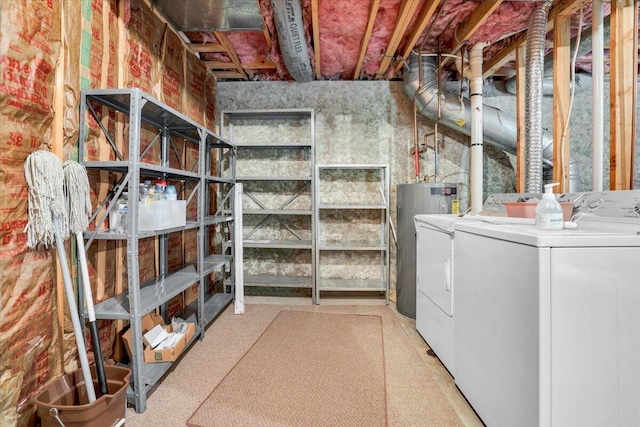 unfinished below grade area featuring washing machine and dryer and water heater