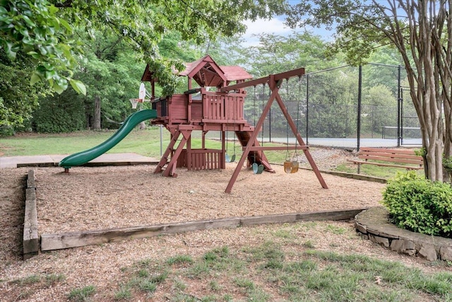 view of jungle gym with fence